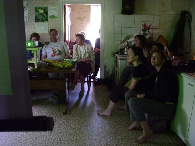 The kitchen of Latvian participants Martins and Zaiga Treimani: family and workers gather to watch and comment on Martins route.